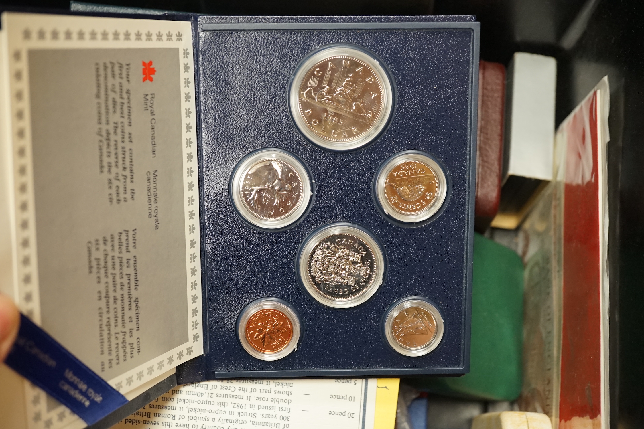 Assorted display sets of coins including two Canadian silver dollars